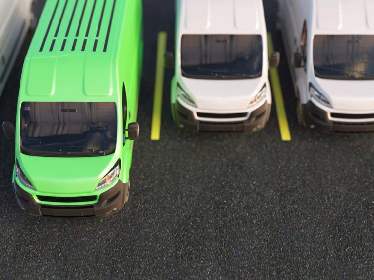 Generic,Green,Electric,Van,Standing,Out,From,Other,Vans,Concept